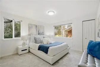 Spacious primary bedroom with great natural light
