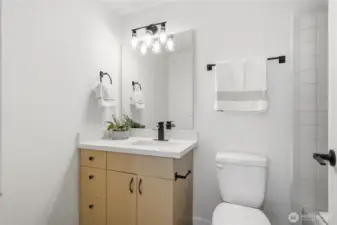 Updated bathroom with new countertop and modern fixtures.