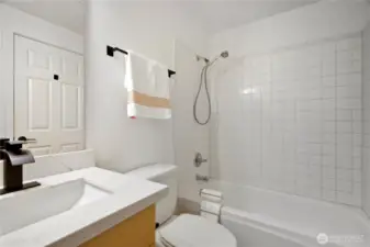 Updated bathroom with new countertop and modern fixtures.