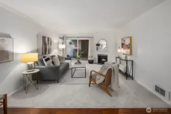 Large slider leads to covered patio and yard.