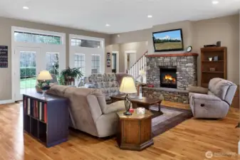 Comfortable living area centered around a cozy fireplace.