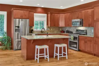 Large island provides additional prep space and casual seating.