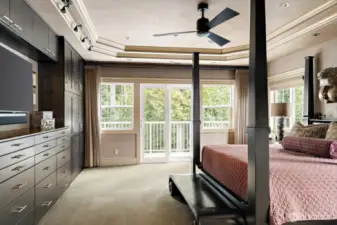 The spacious primary suite opens to the deck, offering ultimate privacy while being bathed in abundant natural light