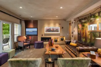 Built in custom cabinetry by DeWils tuck away the TV from sight, to allow you to enjoy the featured art wall.