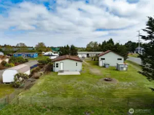 Mixed-Use Zoned 3-bedroom home and shop with a fully fenced .31 acre yard has a 1200 square foot 4 bay shop with a 100 amp service for all your toys or projects, plus an RV hookup