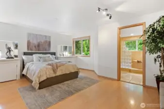 Your spacious primary features built-ins and a gorgeous en suite. Wake up to the birds each morning!