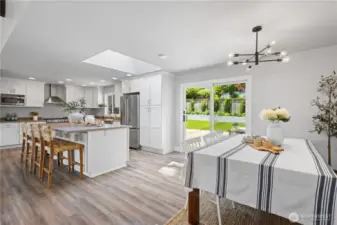 The kitchen and dining area offer a mix of casual and more formal dining options.
