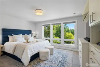Spacious primary suite with walk-in closet, spa-like bath and views of the golf course!