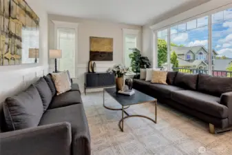 The formal living room offers an intimate setting with picture windows that frame stunning mountain and territorial views.