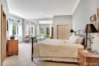 The primary suite is spacious and has it's own private entrance to the screened porch.