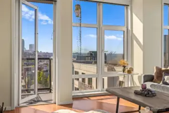 Floor to ceiling windows capture the beautiful natural lighting and views! There are also two balconies to embrace of the sights from.