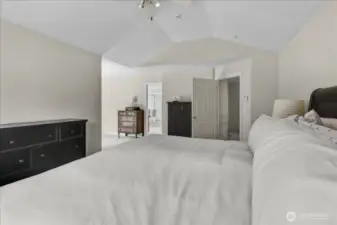 Primary Bedroom with French doors to Private Deck. Has 5 Piece Primary Bathroom Suite complete with Glass Surround Shower, Jetted Soaking Tub, and His & Her Sinks with walk In Closet