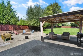 Large Fully Fenced In Back Yard with Storage Shed, Fire Pit, Patio, and Gazebo