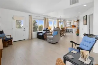 Looking from Family room back into living room and dining room.