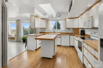 LOTS of light in the kitchen with can lights, skylight and natural light!