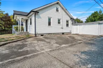 One car detached garage with parking pad off the alley