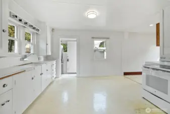 Kitchen door leads to fenced back yard