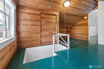 Upstairs landing with under eave storage
