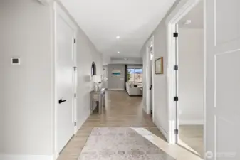 Wide entry with two bedrooms to the left, office to the right.