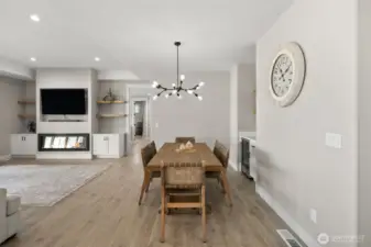 Dining area includes a wet bar with a convenient beverage fridge.