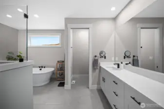 Spa-like en suite just off the primary bedroom. This description highlights the luxurious and relaxing nature of the bathroom, emphasizing its connection and convenience to the main sleeping area.