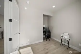 Office space features double doors and nook area.