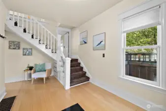Open staircase leads to 3 bedrooms and 1 bath.
