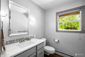 Guest bathroom conveniently located off kitchen and main living room.