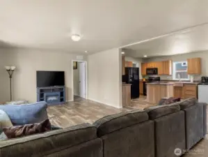This property has an open floor plan in which the living room, kitchen, and dining room seamlessly transition into one another, making it an ideal space for entertaining or simply relaxing with your loved ones.
