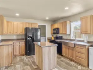 The kitchen offers a nice work flow with tons of counter space surrounding the island