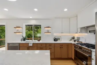 nder cabinet/shelving lights and sleek custom tile backsplash