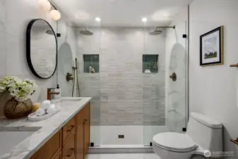 Custom tile work and double shower in primary bathroom