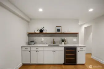 Wet bar equipped w/mini fridge and great storage