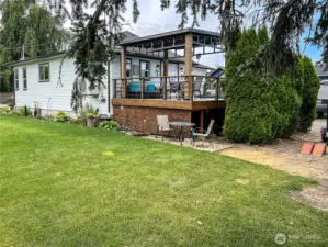 Large side yard with great shade trees for those hot summer days.