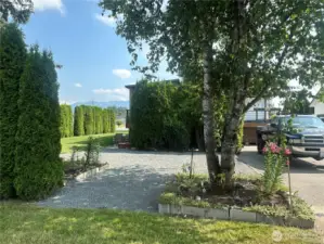 Garden area, extra parking, perfect area for garage, shop or sports court. Use your imagination.