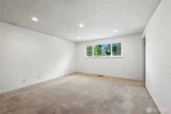 Primary bedroom easily fits a king size bed and bedroom set with room spare