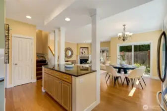 Full kitchen-to-living room view showing open floor plan and seamless design—ideal for entertaining.