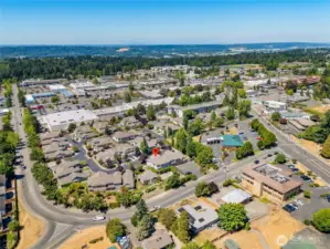 Wide-angle drone shot showing proximity to major roads, local schools, and Kent’s thriving residential area.
