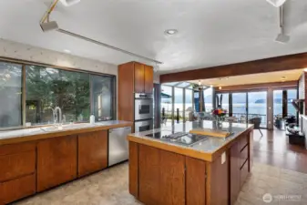 A delight to cook in! this kitchen is ergonomically set up for efficiency and elegance while capturing amazing views.  You don't have to be away from your guests as the family room with fireplace and breakfast nook are just adjacent as is the very large entertainment deck.
