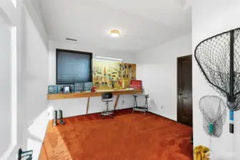 This room is being used as a shop/crafts room but can also be used as a bedroom/den.  There is a closet just off to teh right of the photo
