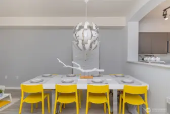 Open dining area with stylish chandelier.