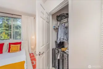 Spacious primary closet offers ample room for organization and storage.