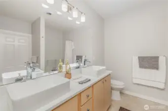 Bathroom with plenty of storage and dual sinks for added convenience.
