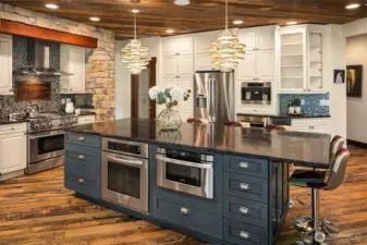 If you like to cook, you will LOVE the top tier appliances in this chef's kitchen.  Double drawer dishwasher, built in Miele coffee maker, beverage chiller and commercial grade ice machine.  Never run out of ice at your parties!  Cabinets extend to the height of the ceiling to offer additional storage for all your culinary needs.