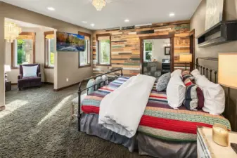 Primary bedroom offers 2 walk in closets, and stunning reclaimed barnwood accent wall.