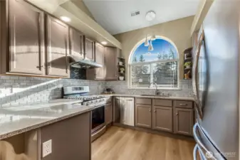 Beautiful kitchen with high end stainless steel appliances.