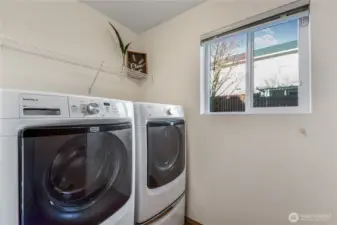 Laundry room off of guest bath.