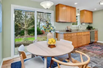 Dining room flow to kitchen and outside.
