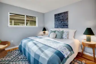 Primary bedroom large enough for king sized bed.