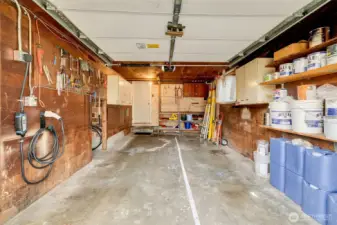 Garage big enough for parking and projects includes high speed EV charger.